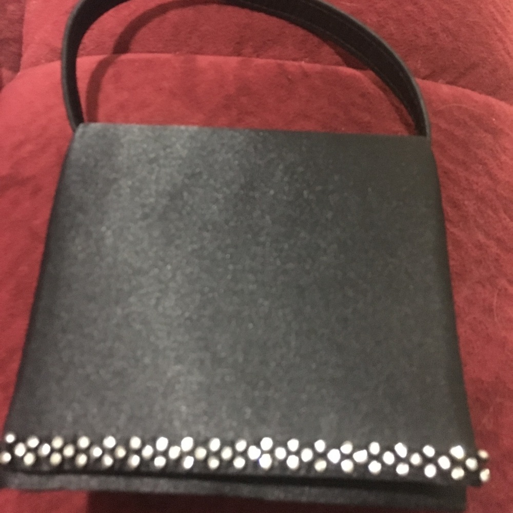 A black evening bag with sparkly rhinestones.